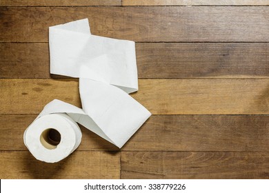Toilet Paper On Wood Background