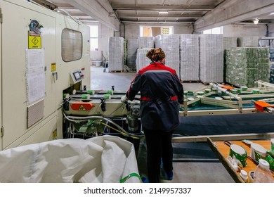 Toilet Paper Production Line. Worker With Conveyor