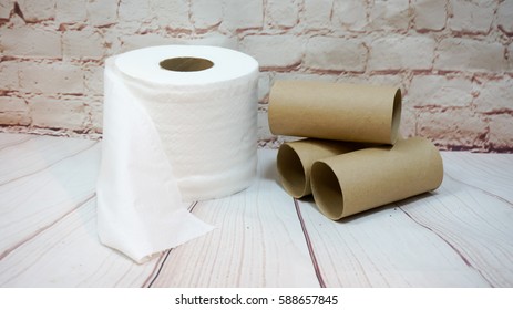 Toilet Paper Roll  And Paper Tubes On  Background.