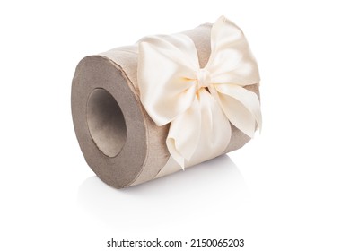 Toilet Paper From Secondary Raw Materials. A Roll Of Toilet Paper Tied With A Beautiful Light Bow Lies On A White Isolated Background. Funny Gift Concept. Present Upon Purchase.