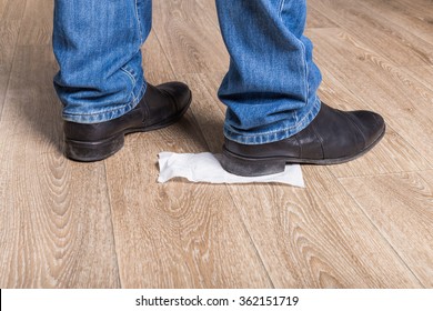 Toilet Paper Stuck To The Sole Of Man's Shoe