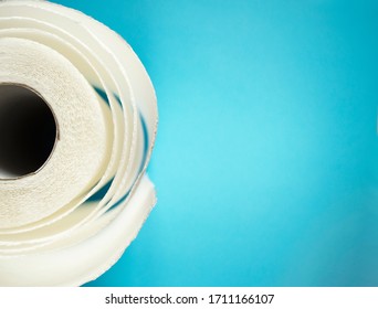 Toilet Paper Top View. Paper Towel Roll On Blue Background. Hygiene Stuff For Everyday. Banner Template With Body Care Products And Copy Space. 