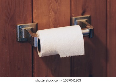 Toilet Paper and Wood Wall