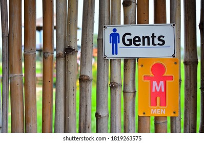 Toilet Sign On Bamboo Wall Over Paddy Field. Gentleman Water Closet (WC) Symbol .