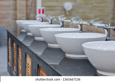 Toilet sink interior of public toilet with of washing hands and mirro