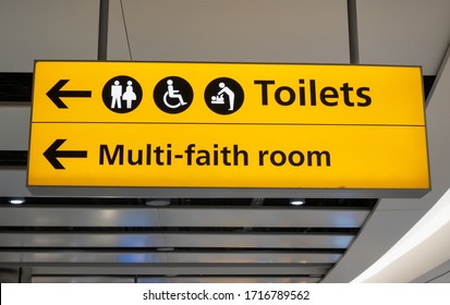 Toilets And Multi Faith Room Sign At An Airport Terminal