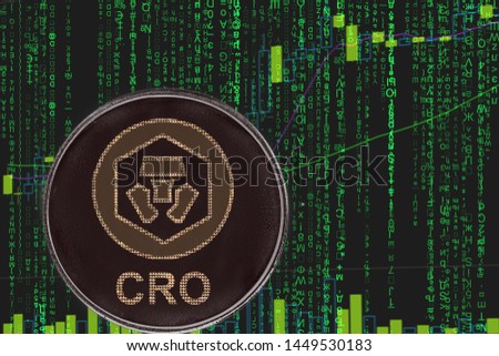 token CRO crypto com chain  cryptocurrency on the green matrix background of binary crypto price chart.