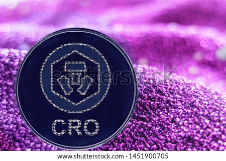 Token cryptocurrency Crypto com chain  and neon fabric background. CRO