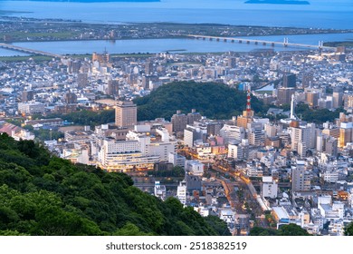 Tokushima, Japan downtown city skyline at blue hour from the mountains. - Powered by Shutterstock