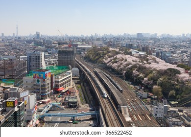 TOKYO - APRIL 2: Top View Of The E3 Series Bullet Train And Cherry Blossom Trees On April 2 , 2015 In Tokyo. E3 Series Service As 