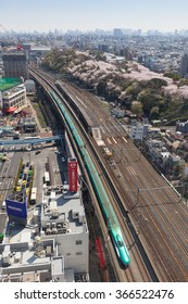 TOKYO - APRIL 2: Top View Of The E5 Series Bullet Train And Cherry Blossom Trees On April 2 , 2015 In Tokyo. E5 Series Service As Hayabusa(Falcon) For Tohoku Shinkansen Line(Tokyo-Shin Aomori Route).