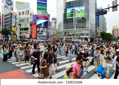 TOKYO - AUGUST 03: Crowds of people crossing the center of Shibuya in August 03 2013, the most important commercial center in Tokyo, Japan