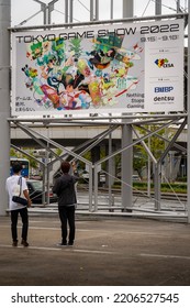 Tokyo Game Show, Chiba, Japan - September 18, 2022: Two People Looking At The Event Poster