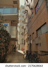 Tokyo, Japan - 02 02 2019: Alleys And Narrow Streets In Tokyo. Futuristic Architecture And Bicycles On A Sunny Day. Contrasts Between Old Lifestyle And Modernity.