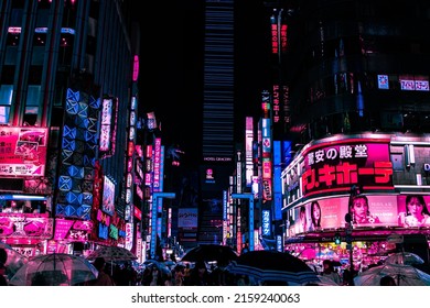 Tokyo, Japan - 05.2022: Abstract Pedestrian With Neon Light From Billboards And Advertisement In Nightlife District Of Kabukicho, Shinjuku, Japan. Nightlife, Futuristic Metaverse City, And Cyberpunk.