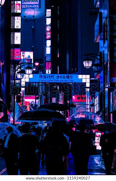 Tokyo, Japan - 05.2022: Abstract Pedestrian
with Neon light from billboards and advertisement in nightlife
district of Kabukicho, Shinjuku, Japan. Nightlife, Futuristic
metaverse city, and
cyberpunk.