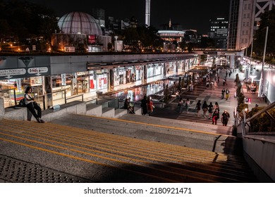 Tokyo, Japan - 05.2022: Tokyo Dome City Attractions Outdoor Shopping Plaza With Tourist And Shopper At Night