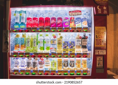 Tokyo, Japan - 06.2022: Japanese Automatic Vending Machine Of Soft Drink And Coffee On The Side Of Street And Alley At Night