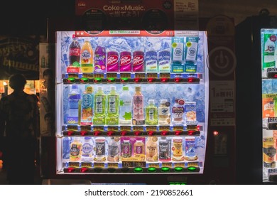 Tokyo, Japan - 06.2022: Japanese Automatic Vending Machine Of Soft Drink And Coffee On The Side Of Street And Alley At Night