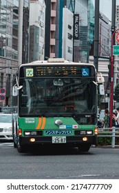 Tokyo, Japan - 06.2022: Portrait Of Toei Bus Stopping At Jingumae Intersection In Harajuku