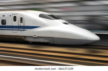 Tokyo, Japan. 09.05.04. Shinkansen Bullet Train speeding through a railway station in Tokyo, Japan.