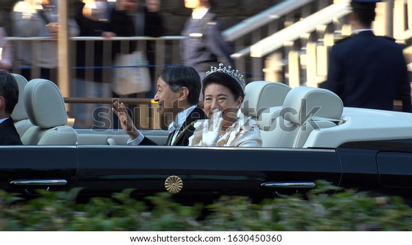TOKYO, JAPAN - 10 NOVEMBER 2019 :\
Japan\'s Emperor Naruhito and Empress Masako on the vehicle at the\
royal parade to mark the enthronement of Emperor\
Naruhito.
