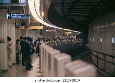 Tokyo, Japan - 10.2022: Crowd Of Commuters And Passengers Waiting For Metro Train On Fukutoshin Line At Ikebukuro Station During Evening Rush Hour