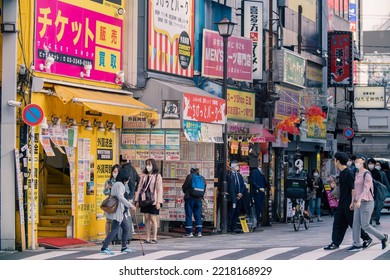 Tokyo, Japan - 10.2022: Crowd Of Pedestrian Crossing Street At Shinjuku Station During Morning Rush Hour To Commute To Work With Road Traffic Congestion