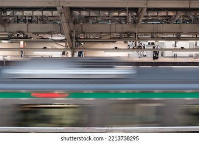 Tokyo, Japan - 10.2022: Express Train Passing Through Platform At Tokyo Station.