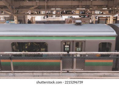 Tokyo, Japan - 10.2022: Japanese JR E231 Series Electric Train On Ueno-Tokyo Line Arriving At Tokyo Station During Evening Rush Hour