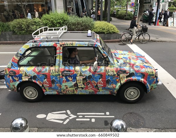 Tokyo\
- Japan - 2017: A small car is covered on a costume rap as part of\
a campaign for local boot company in Tokyo Japan.\

