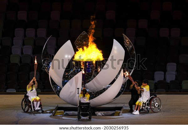 Tokyo,\
Japan. 2021 August 25th. Opening ceremony of the Paralympic Games\
Tokyo 2020. torch lighting with paralympic\
fire.