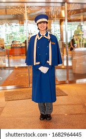 TOKYO, JAPAN - 22 APRIL, 2010: Hotel doorman outside entrance to the Hilton Tokyo Bay