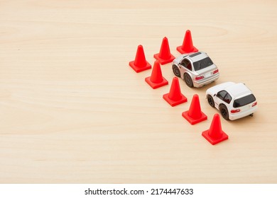 Tokyo, Japan. 25-06-22. Tiny Car Toy Isolated On Wood Background. Car Model. Toys. Miniature Toy. Kids Toy. Toy Collector. Space For Text.