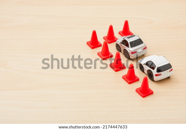 Tokyo, Japan. 25-06-22. Tiny car toy isolated on\
wood background. Car model. Toys. Miniature toy. Kids toy. Toy\
collector. Space for\
text.