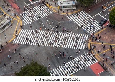 Tokyo, Japan - 26th June 2016: Ariel View Of The Busy Shibuya Crossing, Known As The Scrambles, Where Upwards Of 1000 People Cross The Street Every Time The Lights Change.