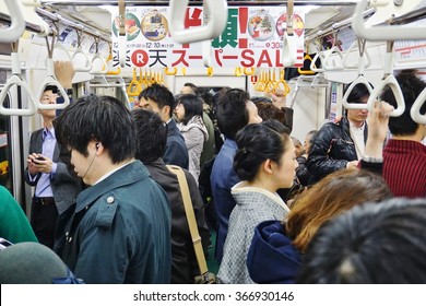 TOKYO, JAPAN -4 DECEMBER 2015- Commuters Are Packed Inside A Car In The Tokyo Metro Subway. The Greater Tokyo Metropolitan Area Has An Extensive Public Transit System.