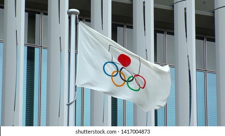 TOKYO, JAPAN - 4 JUNE 2019 : Flag Of The Five Ring Symbol Of The Olympic Games And National Flag Of Japan At Japan Sport Olympic Square. Japan Will Host The Tokyo 2020 Summer Olympics.