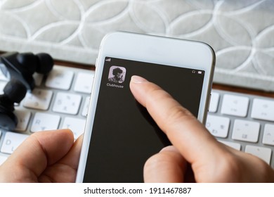 TOKYO, JAPAN - 7 February 2021：Female Hands Operating The Clubhouse App