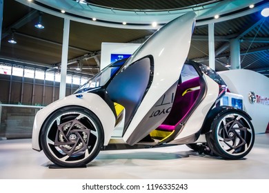 Tokyo, Japan 7 July 2017: Futuristic Car Super Car Japan. Futuristic Electric Car With Blue Light. Concept Of Future. Red Toyota Futuristic And Conceptual Driverless Car.Luxury Automobile Details View