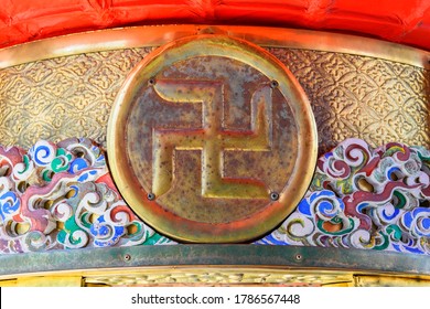 tokyo, japan - april 04 2020: Close-up on japanese manji buddhist swastika or sauwastika engraved on the golden metal rim of Kaminarimon or Thunder gate paper lantern in the Asakusa Sensō-ji temple.