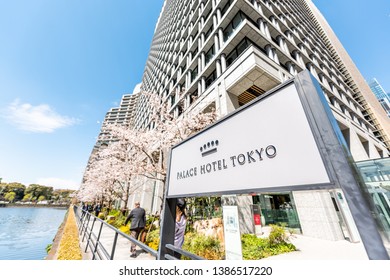 Tokyo, Japan - April 1, 2019: Sign For Palace Hotel In English Wide Angle Closeup View Of Modern Building By Water In Downtown