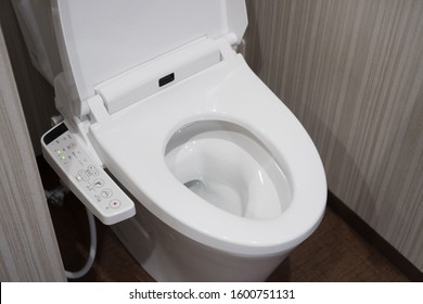 TOKYO, JAPAN - April 1, 2019: Modern high tech toilet with electronic bidet in Japan. Industry leaders recently agreed on signage standards for Japanese toilet bowls.