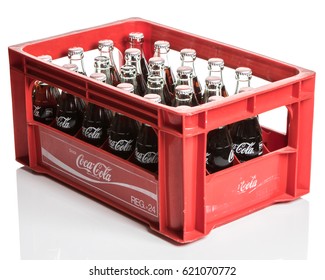 TOKYO, JAPAN - APRIL 11TH, 2017. Coca Cola original taste bottled drinks in red crate. The carbonated soft drink is produced by The Coca-Cola Company.