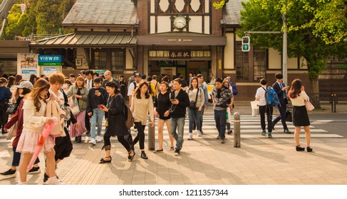 TOKYO, JAPAN - April 12, 2018 : Travelers Are Walking On Street With Sunlight On Background At Harajuku Station, Tokyo Japan