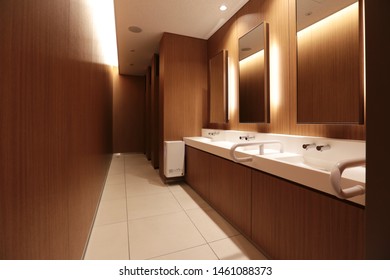 TOKYO, JAPAN - April 13, 2019:  Muji Hotel In Ginza Female Restroom Timber Panel Design Interior And Cove Lighting.