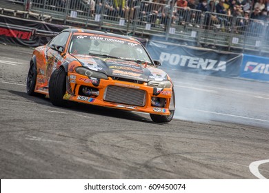 Tokyo, Japan - April 18, 2015: Naoto Suenaga Of YUKE'S Team ORANGE, Performs Drifting During The D1 Grand Prix At Odaiba Special Course.