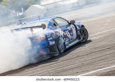 Tokyo, Japan - April 18, 2015: Masashi Yokoi Of D-MAX, Performs Drifting During The Round 1 Of D1 Grand Prix At Odaba Special Course.