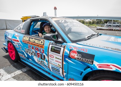 Tokyo, Japan - April 18, 2015:  Japanese Drift Car Driver, Michie Mimoto Of QUARTERMILE RACING, Pose For A Photo At The Round 1 Of D1 Grand Prix At  Odaiba Special Course.