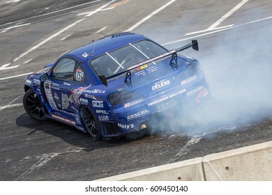 Tokyo, Japan - April 18, 2015: Masashi Yokoi Of D-MAX, Performs Drifting During The Round 1 Of D1 Grand Prix At Odaba Special Course.